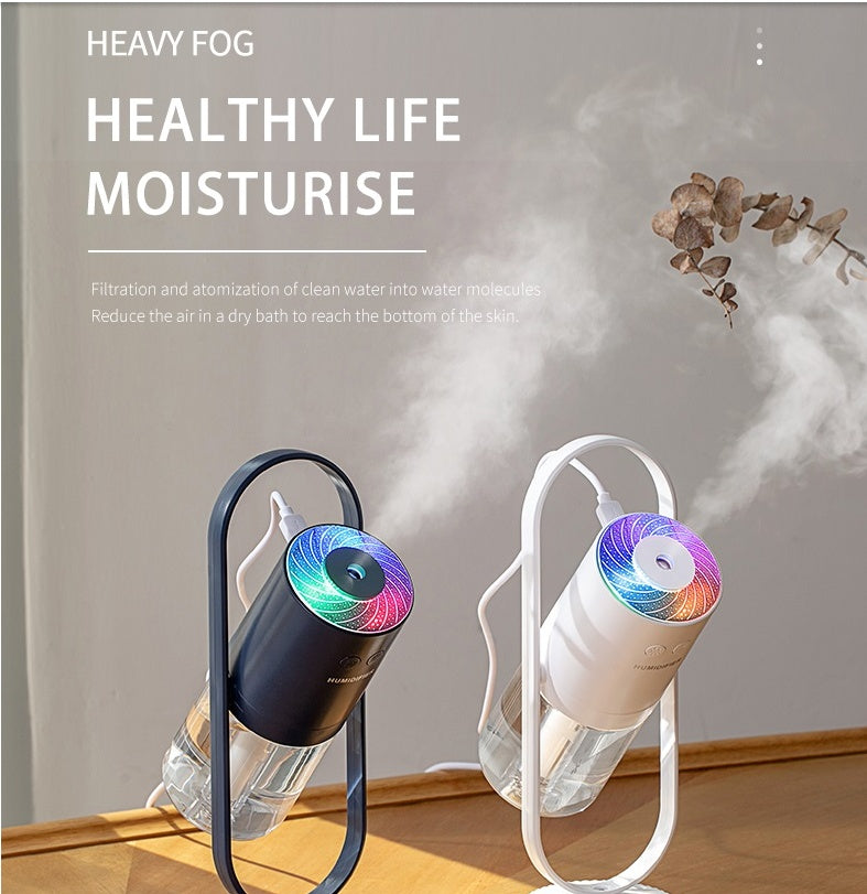 Magic Shadow USB Air Humidifier with Night Projection in black and white emitting mist for room moisture and healthy air
